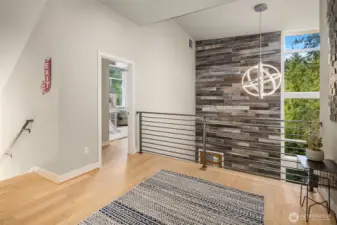 A large loft is wired for media or to be an additional gathering spot