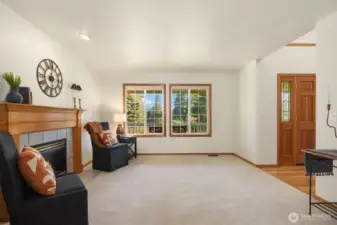 Formal Living Room with propane fireplace. Mountain view.