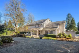 Back exterior with a portion of the circular driveway