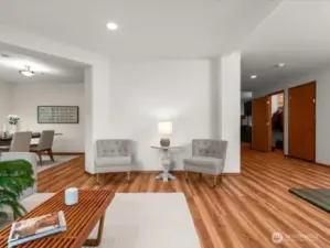 Living room flows into dining room, creating two light and airy, adjoining living spaces for entertaining