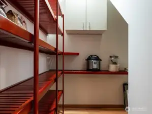 Conveniently located between kitchen and dining rooms, walk-in pantry offers an abundance of storage