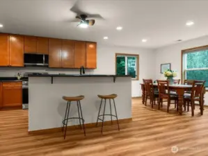 Breakfast bar ideal for morning coffee or serving up buffet style, adjacent to kitchen eating nook