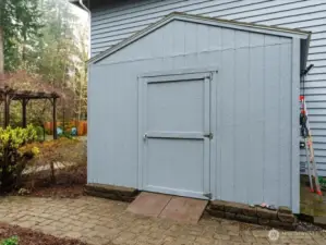 Large garden shed, perfect for storing yard equipment and/or outdoor furniture, conveniently located away from view of house with easy access