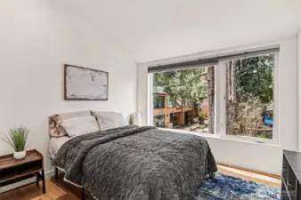 View from this upper level bedroom shows the community space around which all homes are situated.