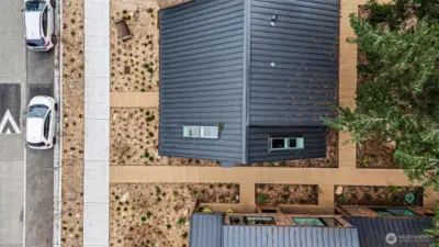 Aerial view of the unit showing metal roof and skylights.