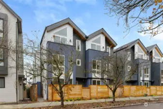 Welcome to Lotus II, a remarkable creation by Shelter Homes, nestled on the serene Mary Ave NW in Whittier Heights. This contemporary exterior features bold architectural lines, and sophisticated textures. Note photos are of similar home 8045G.