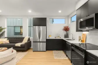 Discover a sleek and functional kitchen featuring stainless steel appliances, a chic tile backsplash, and open shelving to highlight your culinary essentials.