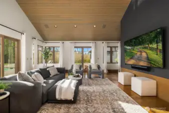 Family/media opens out to the pool, tennis court and covered BBQ patio