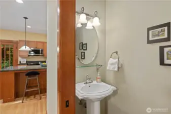 A powder bath is conveniently tucked away off to the side of the kitchen.