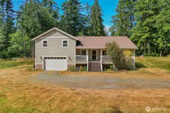 Front of the home with the two car garage and front deck