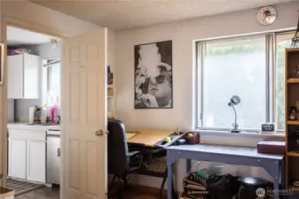 office space off the living room area on the main floor.  connects to kitchen