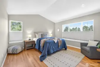 Beautiful primary bedroom and en-suite with views of the gardens