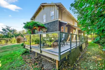 Large deck with Trex decking and glass siding.