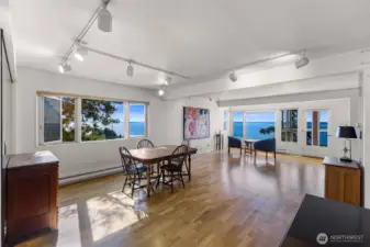 Large dining and open concept living gives plenty of options for arrangement to take in the water views from every living angle