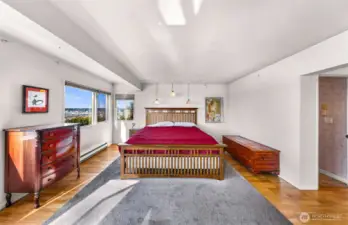 Sunroom leads to Primary bedroom, large spacious room filled with sunlight.