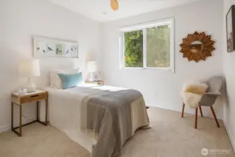 Upstairs bedroom with ceiling fan