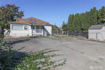 Parking pad in back of home holds many cars!  The shed also stays!