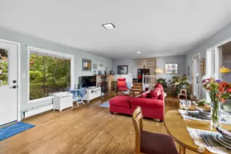 Spacious living room with abundant natural light and a cozy, inviting layout. Ideal for relaxing or gatherings.