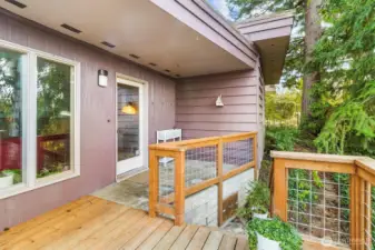 Side deck with access to multiple rooms, offering additional outdoor enjoyment.
