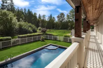 Private pool and patio overlook rolling lawns and lush pastures—perfect for summer entertaining and quiet mornings alike.