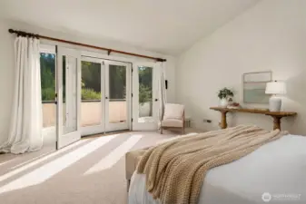 A private balcony overlooks the grounds and scenery.