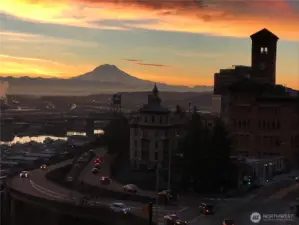 Wall of windows looks to glowing sunrises over Mt Rainier, City of Tacoma & Puget Sound to start your day. Just steps to McMenamins, theater district, Grand Cinema & dining. Great vibe of modern with industrial elements interior design. TOP FLOOR HOME.
