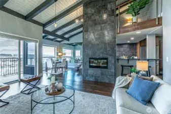 Vaulted ceilings in the great room with a wall of windows to enjoy the views.  Contrasting colors & well chosen finishes let you add your style as the next layer.