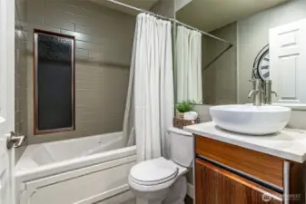 Main bathroom with floating vanity.