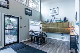 Main lobby with entrance door to the left. Mail boxes and package drop area located here.