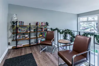 Second floor area with bookcases & seating overlooks the main lobby below.