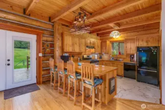 The kitchen is beautiful and has an eating bar