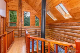 Upstairs is open and offers great views of the living room