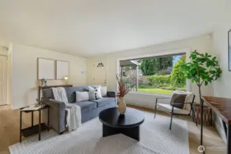 Excellent west facing light in the larger living room- plenty of room for storage options, a larger dining table or in -home office.