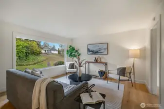 The home has just been refreshed with wide plank LVP flooring and fresh paint throughout.