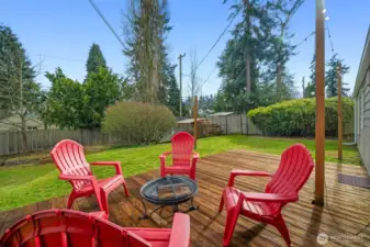 A large wood low deck/patio and a huge yard!