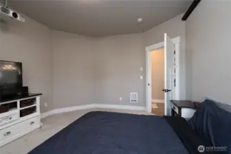 Comfortable bedroom with soft carpet and neutral tones