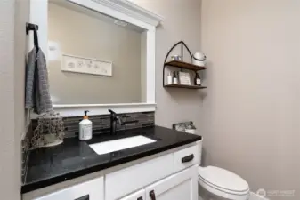 Stylish half bath with modern vanity and sleek finishes