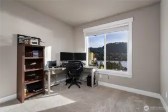 Home office with lake views and dual monitors workspace