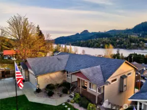 Aerial view of home with lake, mountain, and neighborhood views