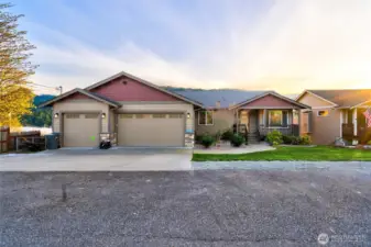 Craftsman-style home with three-car garage and curb appeal