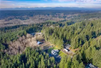 Great Aerial showing the Home and Surrounding Forest Land.  This property is next to and adjoins 300+ Acres of State Lands.  Owners have enjoyed the trails for walking, riding bikes, and riding horses.