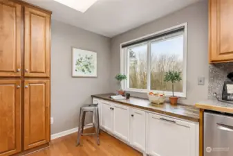 The Corner of this kitchen is perfect for joining the cook with sipping tea on your stool and just visiting.