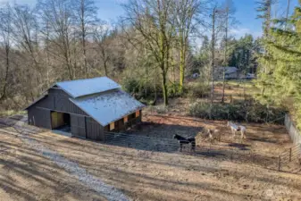 This Big Barn has just been remodeled!  Water Lines, Electricity, and a NewCurtain Drain to make sure it all stays dry!  There are 3 Stalls with a Paddock Area. Huge Hayloft for storing up your Winter Feed, Tack Area Too!