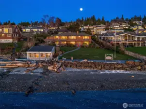 Bordering 107 feet of private shoreline and spreading over a rare combination of sprawling lawns and level half acre grounds, this property offers a priceless opportunity.