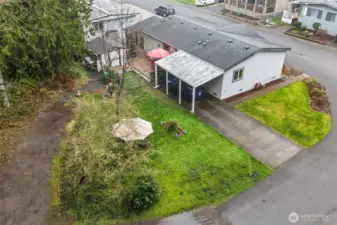 Corner lot location provides extra elbow room, extra parking and outdoor enjoyment.