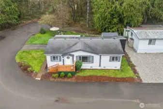 Aerial shot highlights the peaceful, wooded backdrop and ideal cul-de-sac setting.