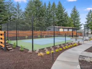Stay active and social with a match on the brand-new pickleball court, surrounded by lush landscaping and nearby seating.