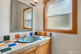 Tiled 1/2 bath off the kitchen & kitchen office area.