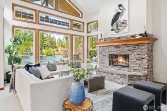 Large Rock Gas Fireplace, High Ceilings & Open Windows to Lake Views. Fresh Paint & Carpets through-out!