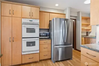 Updated efficient kitchen with granite tiled counters, under cabinet - plus above cabinet lighting.